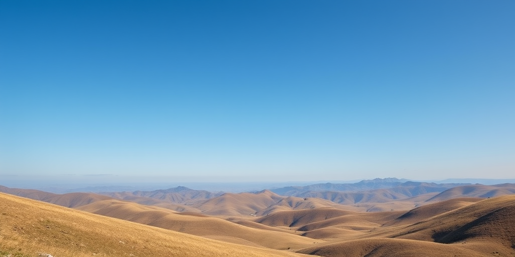 Create a high-resolution image featuring a serene landscape with rolling hills and a clear blue sky, captured with a DSLR camera at f/11, ISO 100, 1/250s shutter speed, using a wide-angle lens at 24mm for an expansive view.