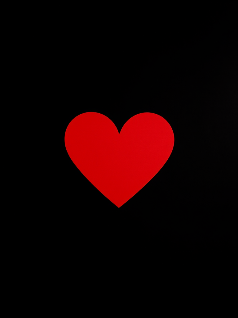 Create a vibrant red heart shape on a solid black background, using a Canon EOS R5 camera with a 50mm lens at f/1.8, ISO 100, and a shooting angle of 45 degrees for depth, ensuring high contrast and sharp edges.