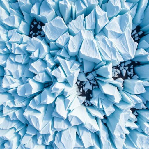 high-resolution aerial view of a glacier with intricate ice formations, sharp focus, natural lighting, ISO 100, f/8 aperture, 1/200s shutter speed, drone photography, wide-angle lens