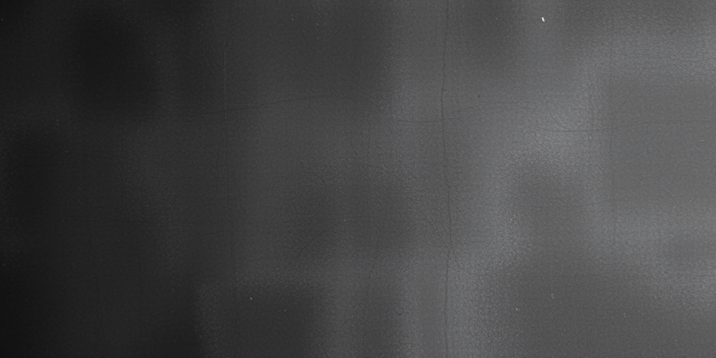 Create a high-resolution abstract texture image with a smooth gradient of dark gray shades, using a DSLR camera with a 50mm lens, f/2.8 aperture, ISO 100, shutter speed 1/125s, shot from a straight-on view in soft natural lighting.