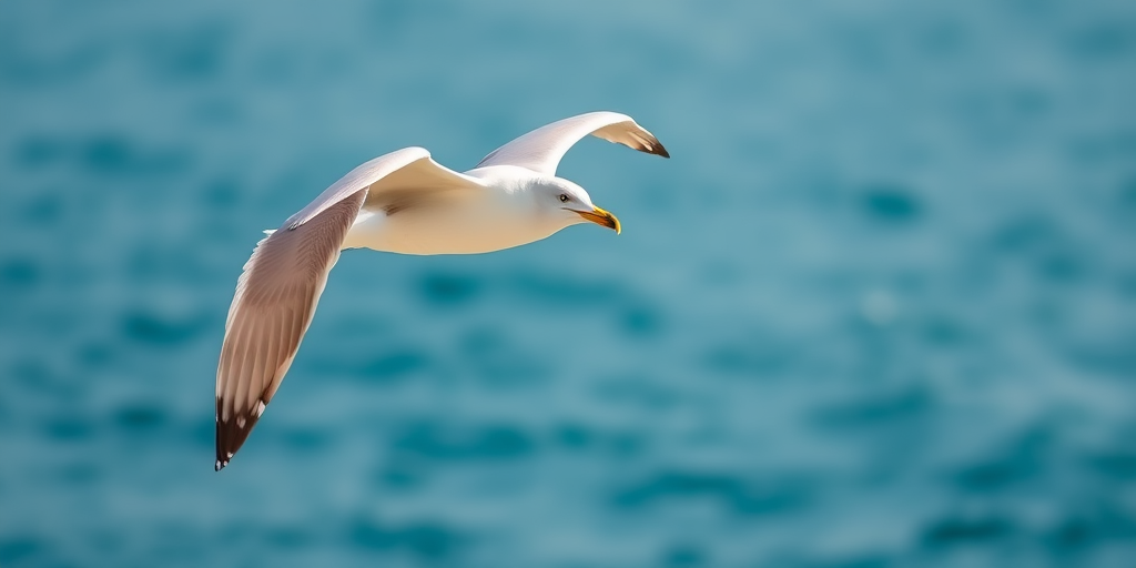 Create an image of a soaring seagull against a soft-focused ocean background, using a DSLR camera with a 50mm lens, aperture set to f/2.8, shutter speed of 1/1000s, ISO 200, in natural light, taken from a low angle to emphasize the bird's wingspan.
