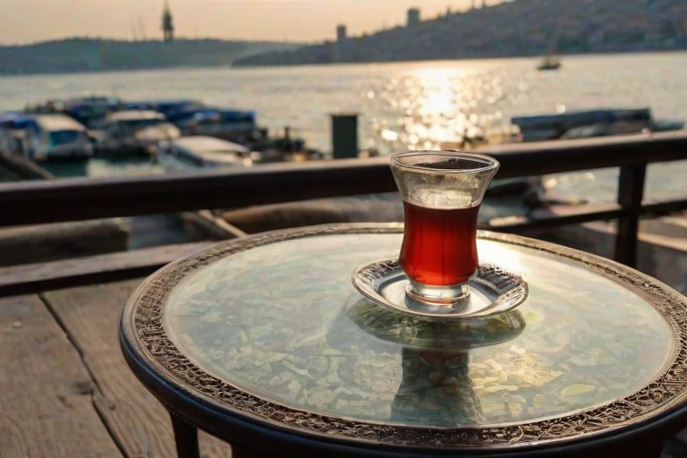 A glass of TurkishTea on a coffee table on the sideway near Bosphorus in Istanbul