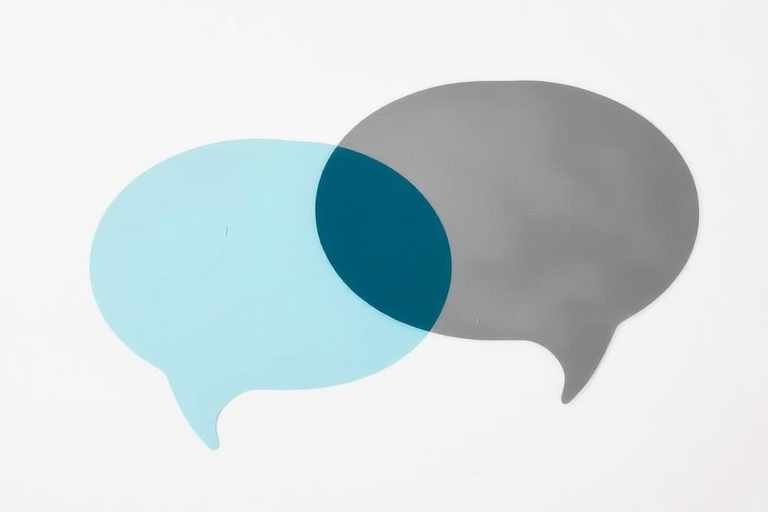 Create two overlapping speech bubbles, one filled with soft blue and the other transparent black, captured with a DSLR camera at f/8 aperture, 50mm lens, shallow depth of field, natural lighting, with a focus on the contours of the bubbles against a minimalistic background.