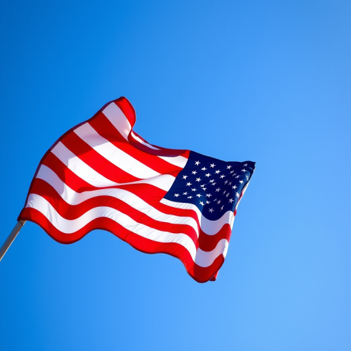 Create an image of a waving American flag against a clear blue sky, captured with a DSLR camera, 50mm lens, f/2.8 aperture, ISO 100, shutter speed 1/1000s, with a vibrant color profile and high dynamic range for enhanced clarity.