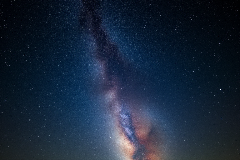 Astrophotography of the Milky Way galaxy in a clear night sky, using a DSLR camera with a 24mm lens, f/2.8 aperture, 20-second exposure, ISO 3200, taken from a high vantage point with minimal light pollution, captured in landscape orientation to emphasize the vastness of the cosmos.
