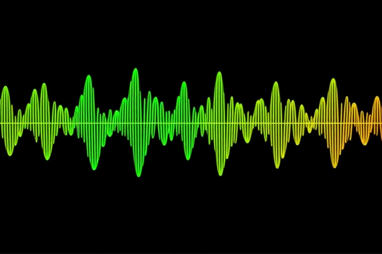Create a digital sound wave visualization with alternating green and yellow waves on a black background, using a Canon EOS R5, 50mm lens, f/1.8, ISO 200, 1/100s shutter speed, and a macro view to ensure sharp detail and high contrast.