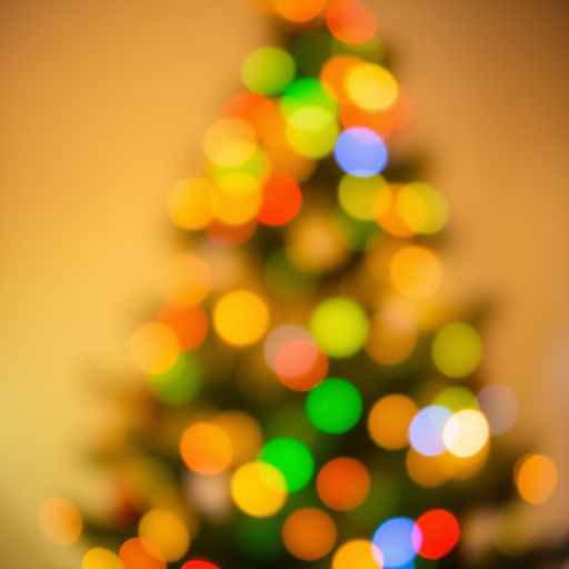 Create an abstract image of a softly blurred Christmas tree with colorful lights in various shades of red, green, blue, and yellow, creating a warm and festive atmosphere. The background should suggest a cozy holiday setting with a gentle bokeh effect.