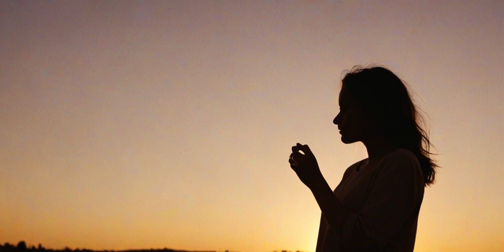 sunset, silhouette, woman, heart shape, hand gesture, warm colors, outdoor, dusk, sky, creative pose, backlit, soft focus, landscape, golden hour, tranquility, leisure activity, nature, serene, orange tones, casual attire