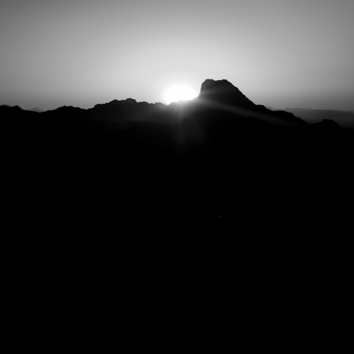 Create an artistic black and white silhouette of a mountain landscape at sunset, captured with a Canon EOS 5D Mark IV, 50mm lens, f/8 aperture, ISO 100, with a panoramic view and dramatic contrast.