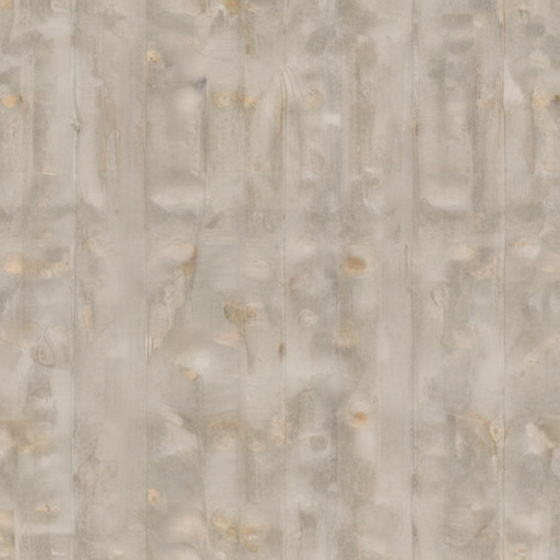 Textured Surface of Lightly Stained Wood with Subtle Grain Patterns