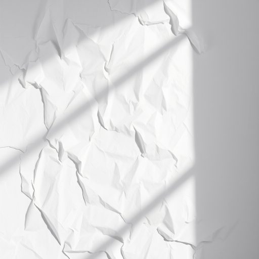 Create a high-resolution image of a crumpled white paper background with soft shadows, shot with a DSLR camera at f/4 aperture, ISO 100, 50mm lens, in natural light from a side window for enhanced texture and depth.