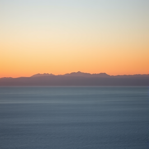photograph of distant mountains silhouetted against a clear sky over a calm sea, taken with a Canon EOS R5, 50mm lens, f/8, ISO 100, 1/200 sec, golden hour lighting, wide-angle view for depth.