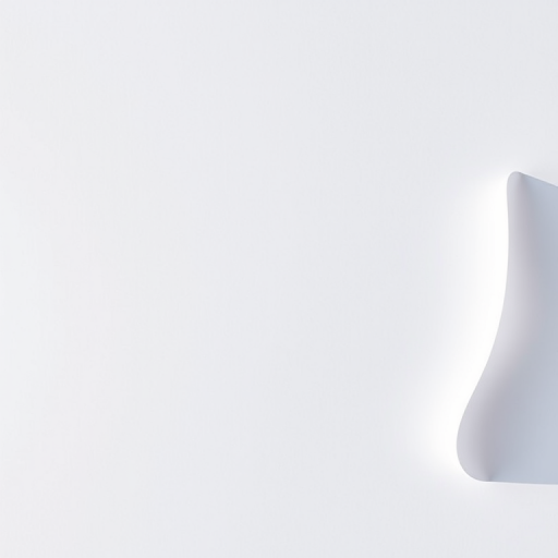Create a blank white sheet of paper with a slight curl in the top right corner, shot with a 50mm lens, aperture f/4, ISO 100, in natural daylight, using a DSLR camera to enhance image quality.
