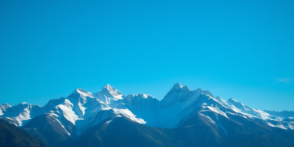 majestic snow-capped mountains under a clear blue sky, shot with a DSLR camera, 50mm lens, f/11 aperture, ISO 100, shutter speed 1/250s, high dynamic range, focus on the mountain peaks with a wide angle view for depth and clarity