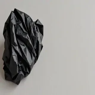 black crumpled paper
