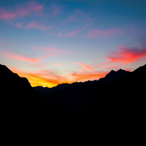 Generate a high-resolution image of a silhouette of a mountain range during sunset with vibrant colors in the sky, using a DSLR camera set to ISO 100, aperture f/11, shutter speed 1/250s, shot from a wide-angle lens at a 24mm focal length for enhanced depth and clarity.