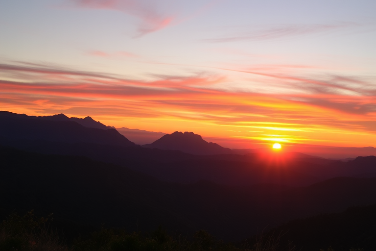 Generate a high-resolution image of a sunset over a mountain range with vibrant colors, using a DSLR camera, 35mm lens, f/8 aperture, ISO 100, and a shot from a low angle to capture foreground details and enhance depth.