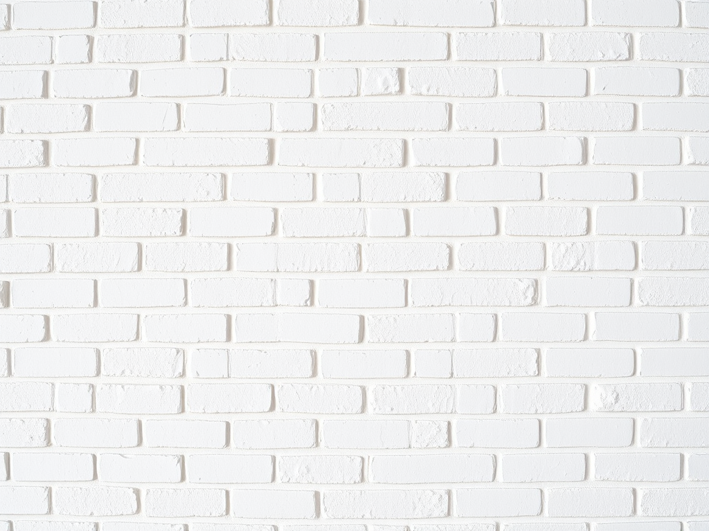 High-resolution image of a seamless white brick wall, shot with a Canon EOS R5, 50mm lens, aperture f/8, ISO 100, natural light, straight-on view, minimal shadows, emphasis on texture and detail.