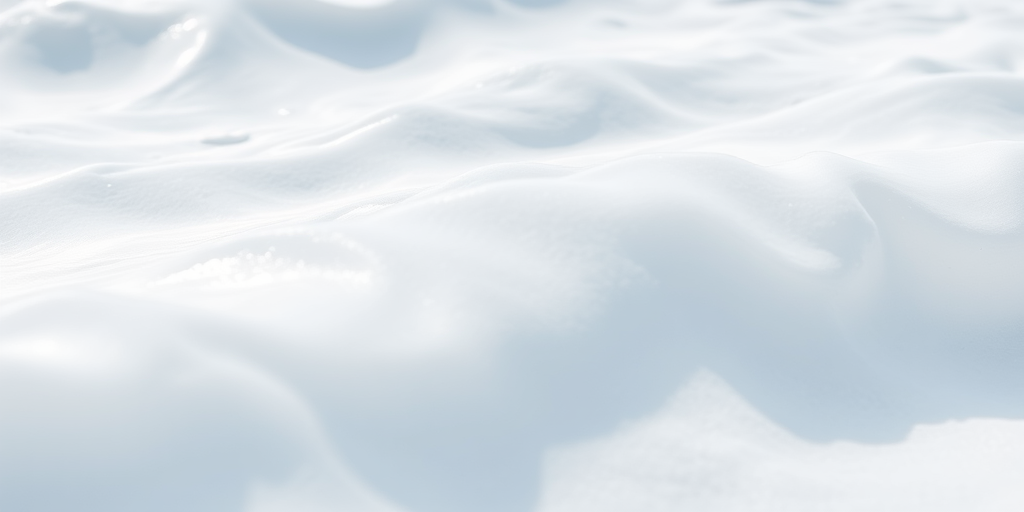 Create a high-resolution image of smooth, flowing white waves with a soft texture, using a Canon EOS R5 camera, 50mm lens, f/1.8 aperture, ISO 100, 1/200s shutter speed, in natural light, capturing a close-up view with a focus on the intricate details and shadows.