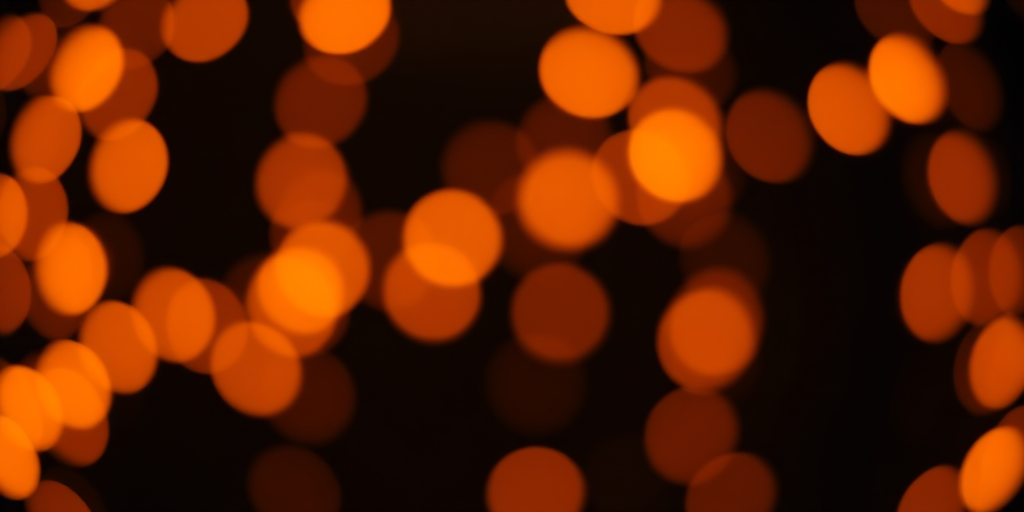 create a soft-focused background image with an abstract pattern of orange bokeh lights on a dark backdrop, using a 50mm lens at f/1.8, ISO 200, shutter speed 1/60s, captured in a DSLR style portrait orientation.