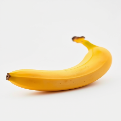a perfectly ripened banana with a smooth yellow peel, captured with a Canon EOS R5, 50mm f/1.2 lens, aperture at f/2.8, natural daylight lighting, shallow depth of field, against a plain white background for enhanced detail and texture
