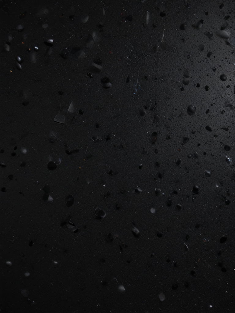 Abstract Dark Surface with Textured Drops and Subtle Variations in Light