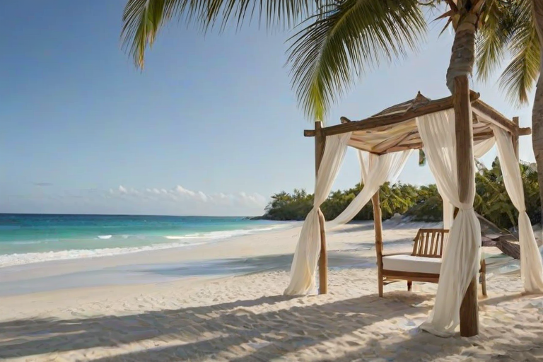Create a picturesque tropical beach scene featuring a serene, white sandy shore. In the foreground, there's a rustic wooden canopy with white drapes gently flowing in the breeze. Underneath the canopy, a table is set with tropical decor, evoking a sense of relaxation and leisure. The beach extends into a calm, shallow water area with reflections of the sky and surroundings. Palm trees and lush greenery line the edge of the beach, providing a natural, tropical backdrop. The sky is clear with a few scattered clouds, and the overall atmosphere is tranquil and inviting, perfect for a peaceful retreat.