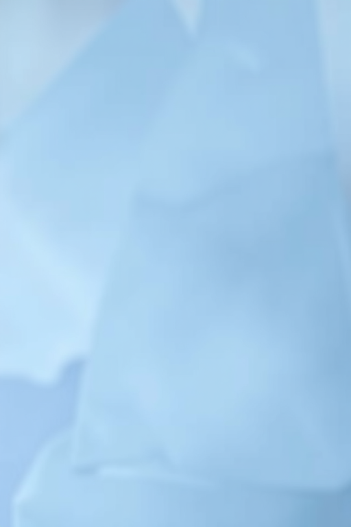 create a soft, textured background in shades of blue, using a DSLR camera with a 50mm lens, aperture set to f/2.8, ISO 100, natural light, capturing a shallow depth of field for enhanced detail and smooth gradient transitions.