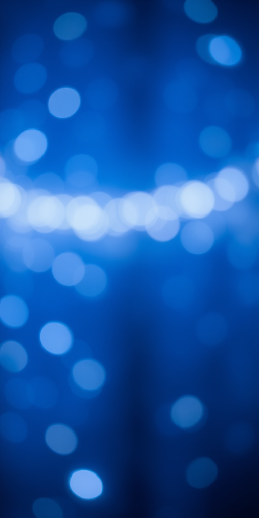 Create an image of a blue background with scattered white lights, captured with a Canon EOS R5, 35mm lens, f/2.8 aperture, ISO 400, using a soft focus style for an ethereal effect.