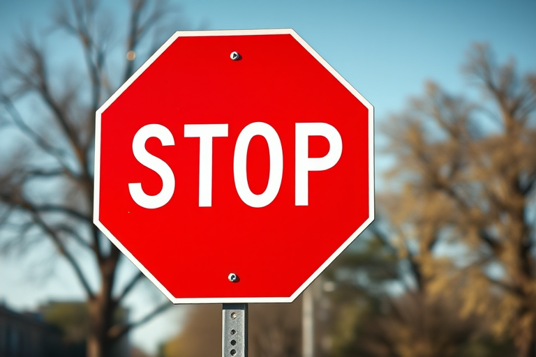 Create an image of a stop sign with a vibrant red color and bold white text in the center, using a DSLR camera with a 50mm lens, aperture set to f/2.8, ISO 100, shot from a straight-on angle to emphasize clarity and sharpness.