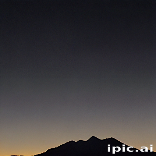 Majestic Mountain Silhouette Against a Tranquil Twilight Sky at Dusk