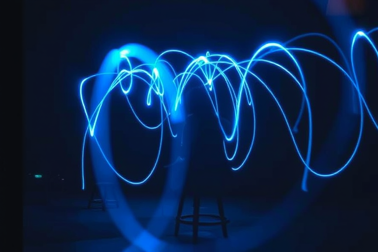 Create a high-resolution image of a person sitting in a chair, surrounded by glowing blue light trails, using a DSLR camera with a 50mm f/1.8 lens, aperture set to f/1.8, ISO 200, shutter speed 1/60s, low-light ambient setting, cinematic style, shot at eye level.