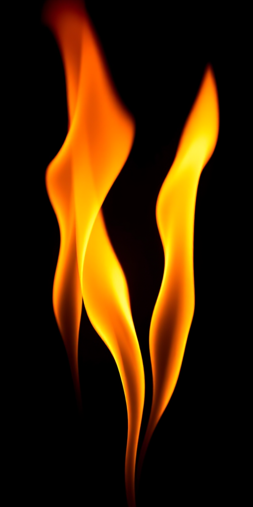 Create a visually striking image of three vibrant flames in shades of orange and yellow, using a DSLR camera with a 50mm lens at f/1.8, ISO 100, captured from a low angle to enhance the dynamic shapes against a dark background.